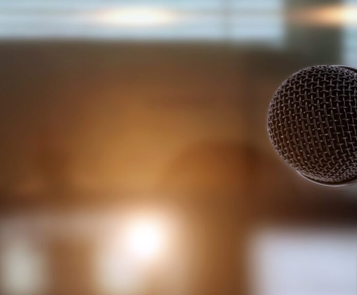 Microphone,With,Blur,Light,Background,For,Reporter,Report,New,Or